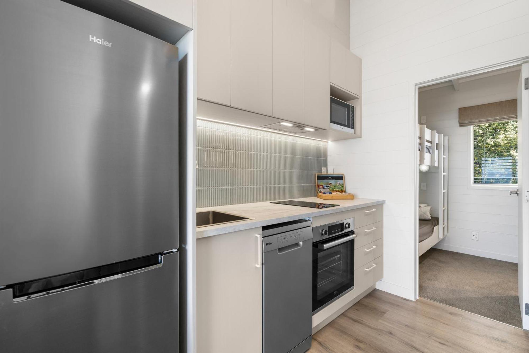 Tasman Holiday Parks - Papamoa Beach Exterior photo A kitchen in a typical apartment