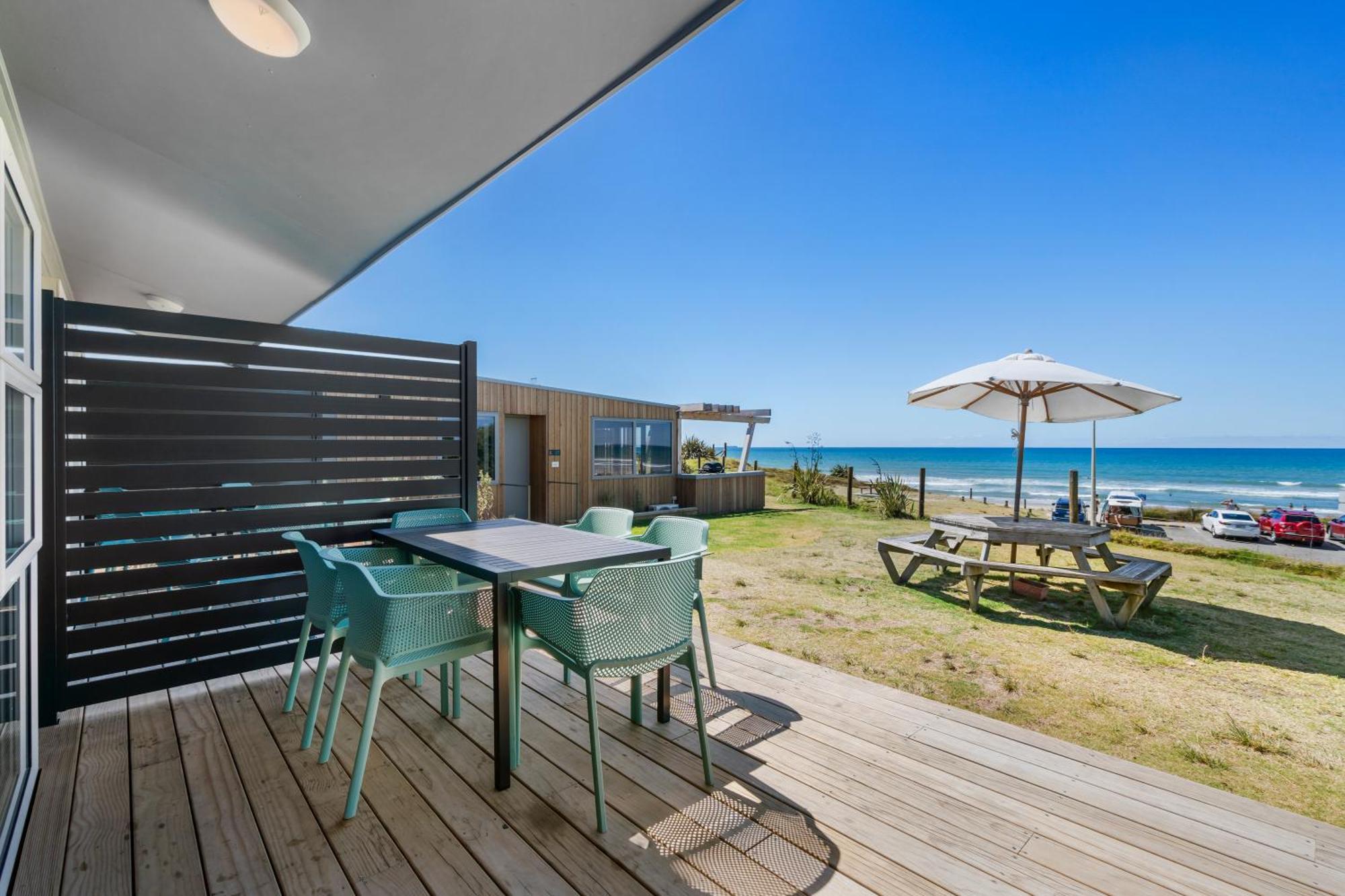 Tasman Holiday Parks - Papamoa Beach Exterior photo A view of the beach from the deck of a beachfront apartment